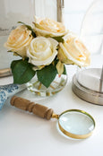Elliot Magnifying Glass with artificial rose in glass vase