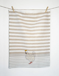 Country Pearl Chicken Tea Towel hanging on clothes line