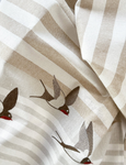 Country Swallow Tea Towel showing close up of embroidered swallow detail