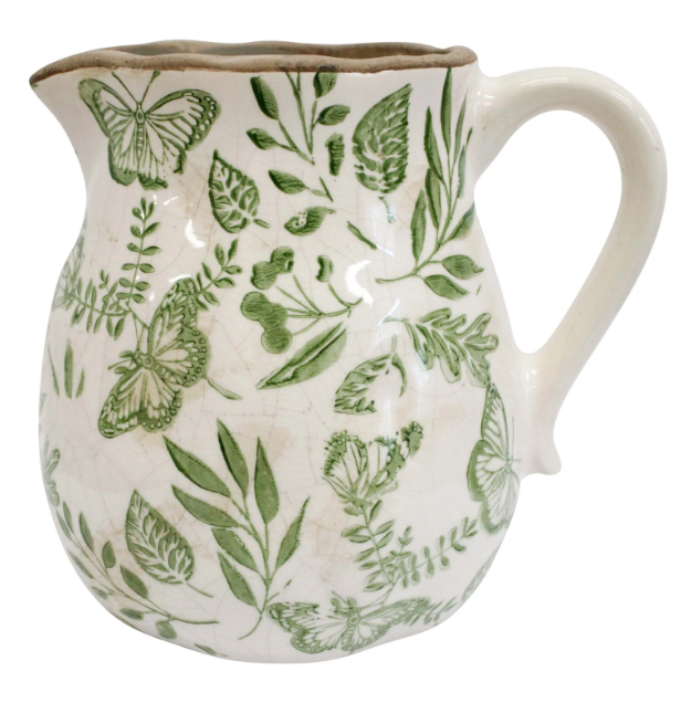 Medium ceramic jug with green butterfly and foliage design on an off-white base, 16x13x15.5cm.