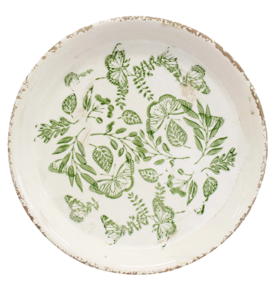 Ceramic plate with green butterfly and foliage design, glazed finish, and weathered rim, 23.5cm.
