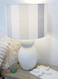 Newport Lamp with white ribbed polyresin base and striped cotton shade in soft blue and neutral tones, Hamptons-style table lamp styled on timber console