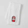 white cotton hand towel with embroidered a festive wreath window motif.