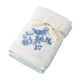 Chinoiserie Hand Towel Set of 2 featuring one plain white towel and one embroidered towel with a blue bird and floral design.