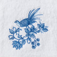 Chinoiserie Hand Towel Set of 2 featuring one plain white towel and one embroidered towel with a blue bird and floral design.