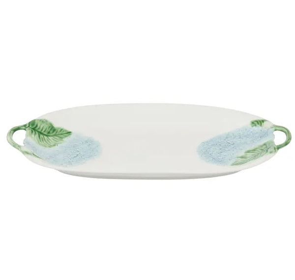 A ceramic platter with a blue hydrangea and green leaf pattern against a white background.