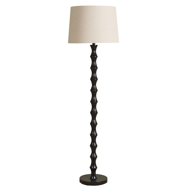 Newsom Floor Lamp with sculptural black stacked base and natural textured shade.