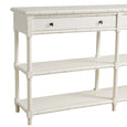 White Portico Console with bamboo-inspired accents, two drawers with brass pulls, and two lower shelves in an elegant coastal style design.