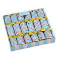 A set of La Dolce Vita Seaside Crackers in bright coastal prints, tied with yellow bows, displayed in a striped gift box. Includes seaside-themed gifts, mottos, and paper crowns.