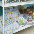 A set of La Dolce Vita Seaside Crackers in bright coastal prints, tied with yellow bows, displayed in a striped gift box. Includes seaside-themed gifts, mottos, and paper crowns.