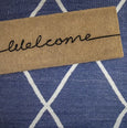 Welcome Doormat Long made from 100% natural coir with black script, durable and stylish design for double front doors, sliding doors, or bi-fold entrances.