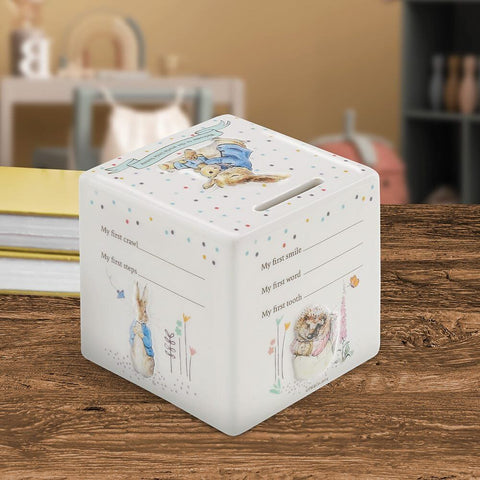 Beatrix Potter baby keepsake box with soft pastel illustrations styled on wooden table for nursery gifting