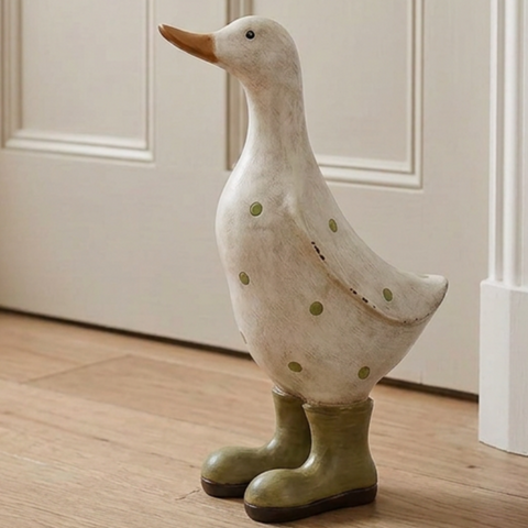 Bird and animal decor - white polka dot duck with olive green gumboots styled in a Hamptons country cottage entrance