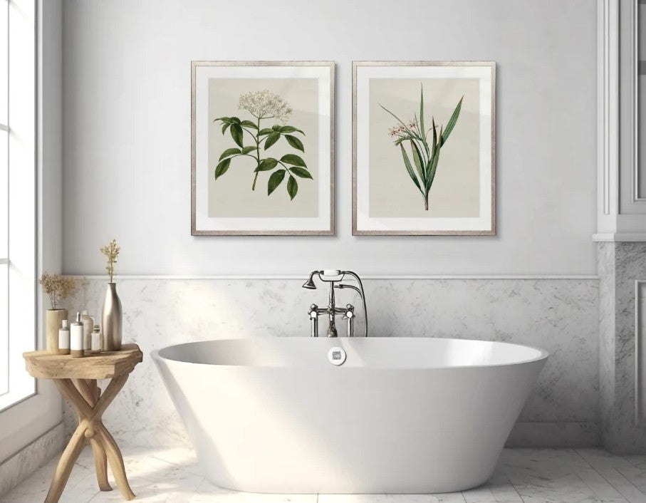Designer Boys floral botanical artwork displayed above a freestanding bath in a light-filled Hamptons style bathroom with marble finishes and natural timber accents.