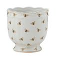 White ceramic pot with gold bee pattern and scalloped rim.