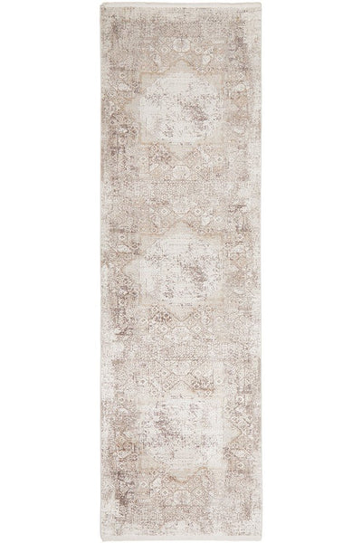 Arley Stone Runner with stone-toned distressed medallion pattern in neutral hues displayed in a hallway.