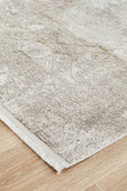 Arley Stone Runner with stone-toned distressed medallion pattern in neutral hues displayed in a hallway.