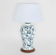 Blue and white ceramic table lamp with bird and floral pattern on wooden base and white shade
