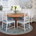 Bridgeport blue round rug underneath the mulhouse timber dining table