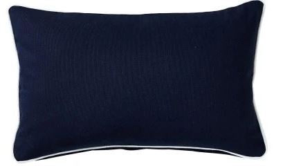 Navy lumbar cushion with white piping in heavy cotton canvas