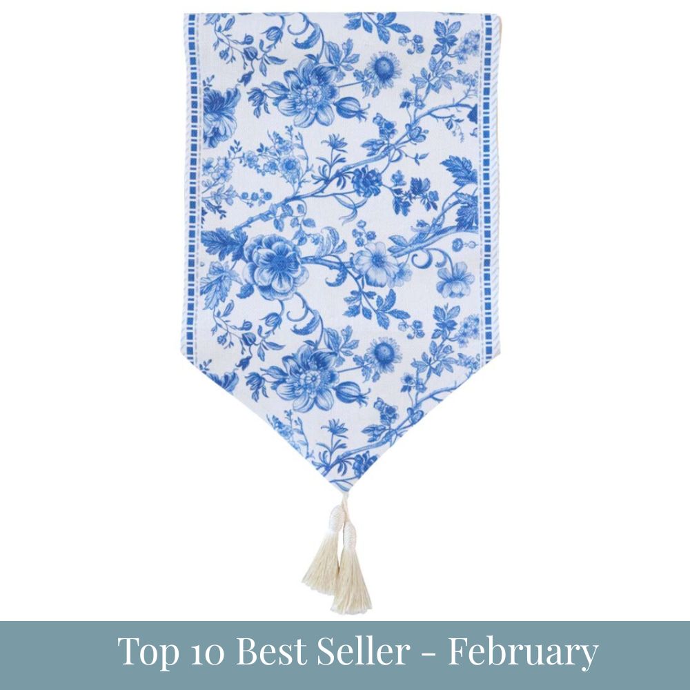 Blue and white floral Bayview Bloom table runner with tassel detail with top 10 best seller - february overlay