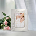 Beatrix Potter 15.7cm Beatrix Potter Christening Baby Photo Frame with baby photo inside and a bunch of pink roses to the side 