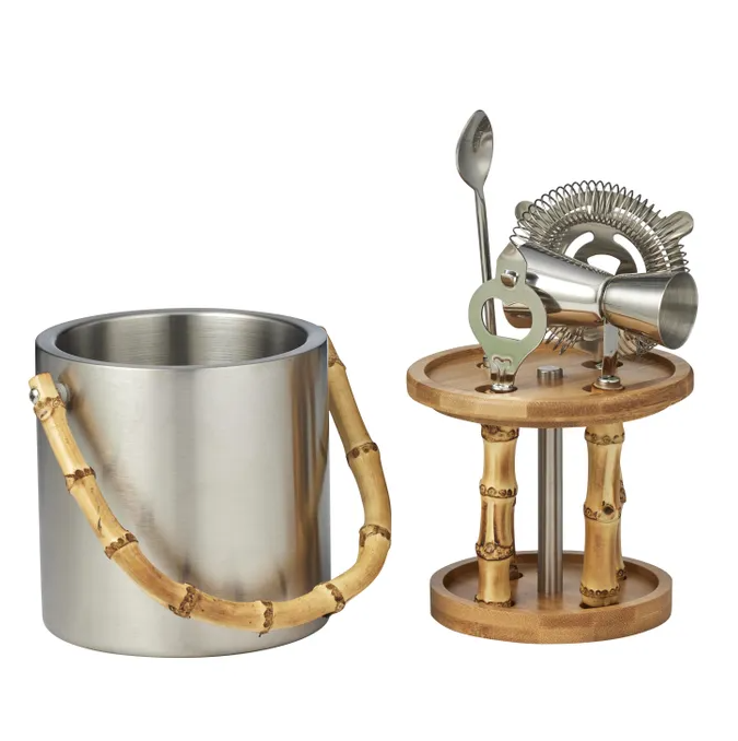 Stainless steel ice bucket with bamboo handle and matching bamboo bar tool stand, featuring a jigger, strainer, opener, and spoon — elegant bar set for entertaining.