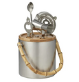 Stainless steel ice bucket with bamboo handle and matching bamboo bar tool stand, featuring a jigger, strainer, opener, and spoon — elegant bar set for entertaining.