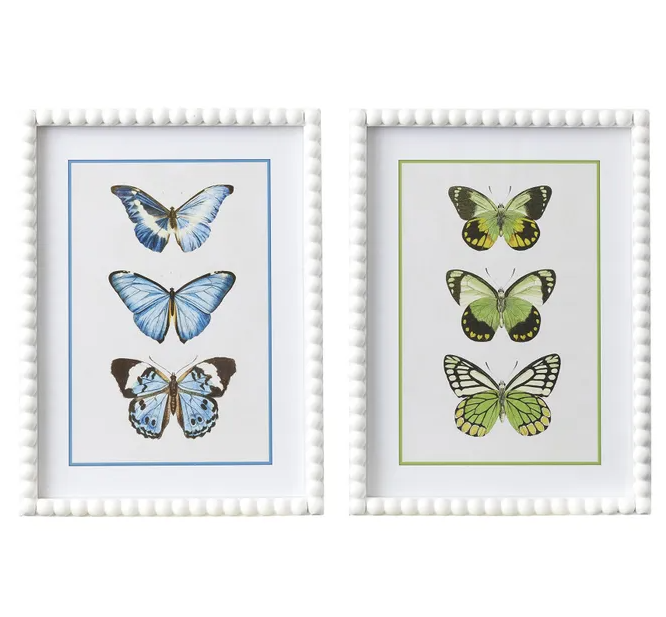 Bellamy Frame Glass Print featuring a trio of illustrated butterflies in a white bobbin-style timber frame with a glass front. Available in green or blue with a matching mat board for a refined coastal look.