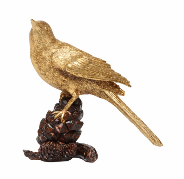 Gold bird ornament perched on a pinecone, 17cm.