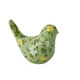 Blooming Bird Sculpture Small Green – decorative resin bird ornament with hand-painted yellow and white flowers on a soft green finish.