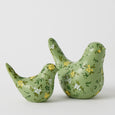 Blooming Bird Sculpture Small Green – decorative resin bird ornament with hand-painted yellow and white flowers on a soft green finish.