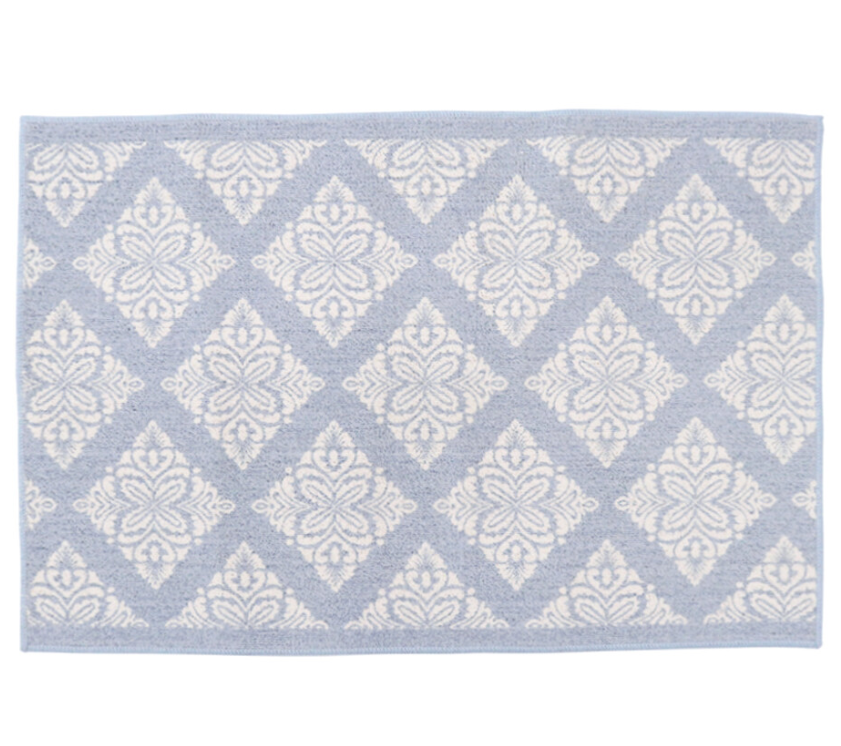 Blue and white patterned floor mat with non-slip backing.