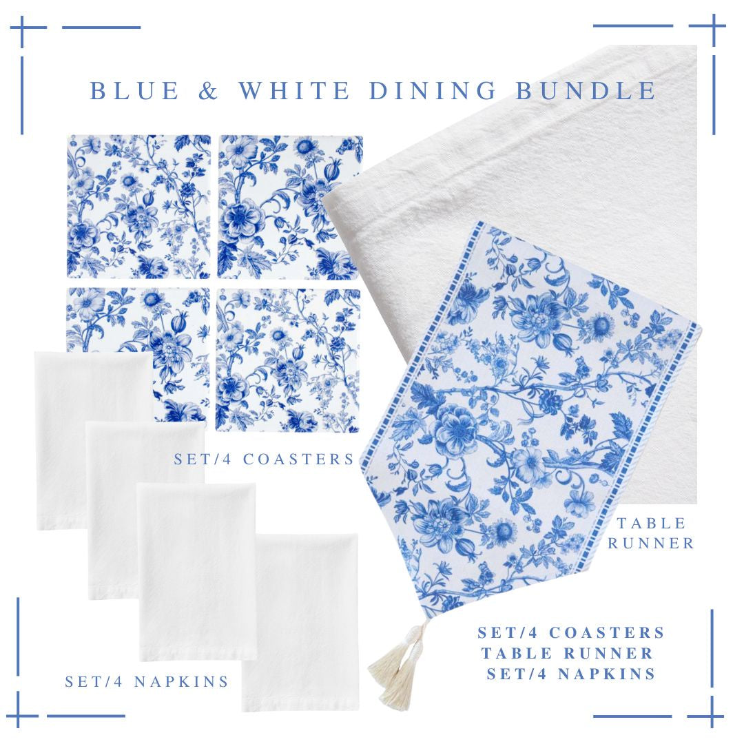 Flatlay of Blue & White Dining Bundle including floral coasters, white linen napkins, and matching blue-and-white table runner.