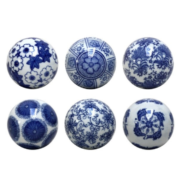 Blue and white botanical ceramic decorative balls set of six on white background