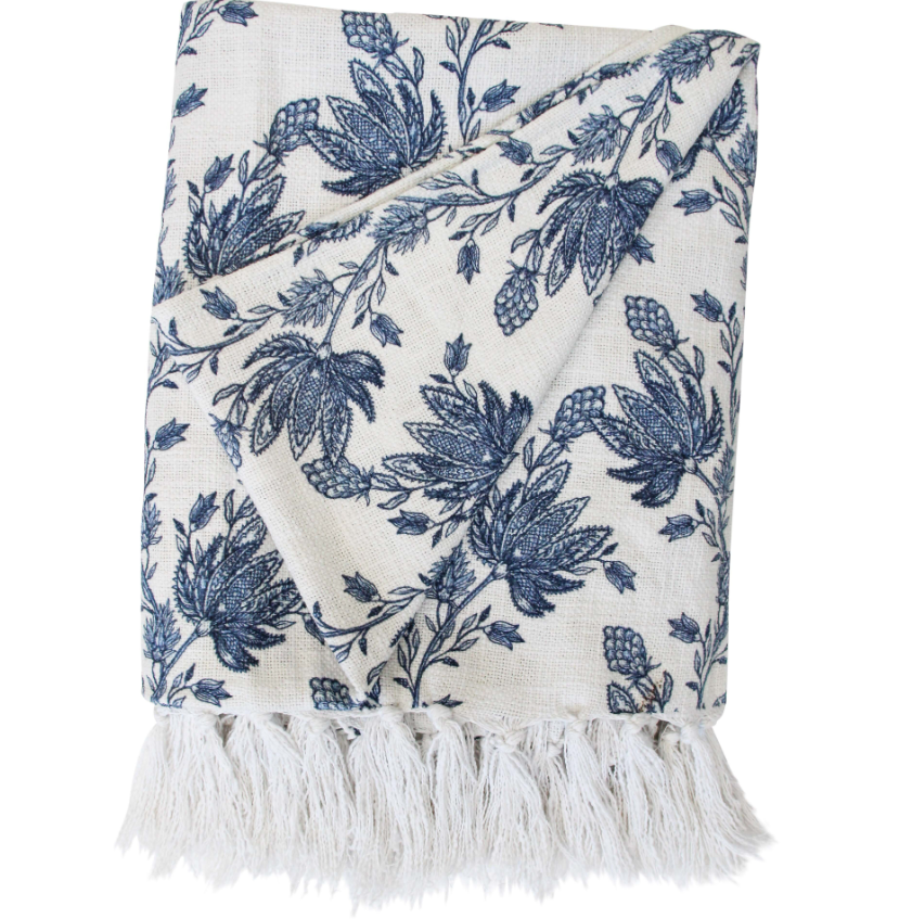 Bluebell Bloom blue and white floral throw folded with fringe detail on a white background