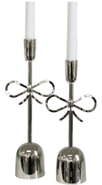 Nickel bow candlestick medium with polished silver finish, shown on a white background