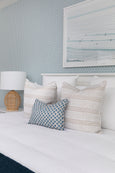 Bridgehampton rattan lamp styled in Hamptons bedroom with coastal décor