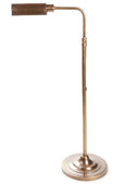 Brooklyn adjustable floor lamp in steel and bronze lighting a reading corner