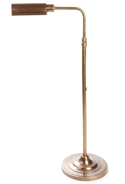 Brooklyn adjustable floor lamp in steel and bronze lighting a reading corner