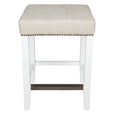 White kitchen stool with natural linen seat and brass footrest