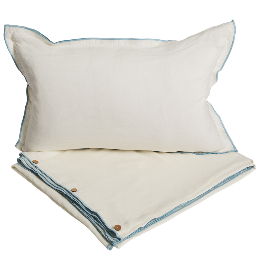 Cape quilt cover set in off white linen with sky blue edging and wooden button detail