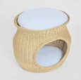 Cove natural rattan pet bed with open front and striped cushion