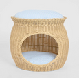 Cove natural rattan pet bed with open front and striped cushion