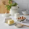 Darley Stoneware kitchen collection featuring butter dish, compost bin, egg tray, and ceramic kitchen accessories in cream speckle finish