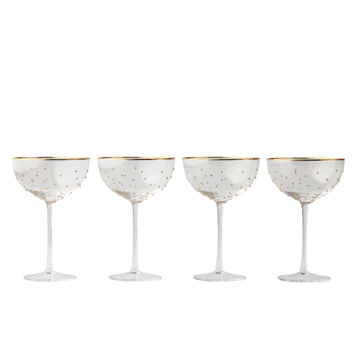 Set of four coupe glasses with raised gold dots and gold rim, elegant glassware for champagne and cocktails.