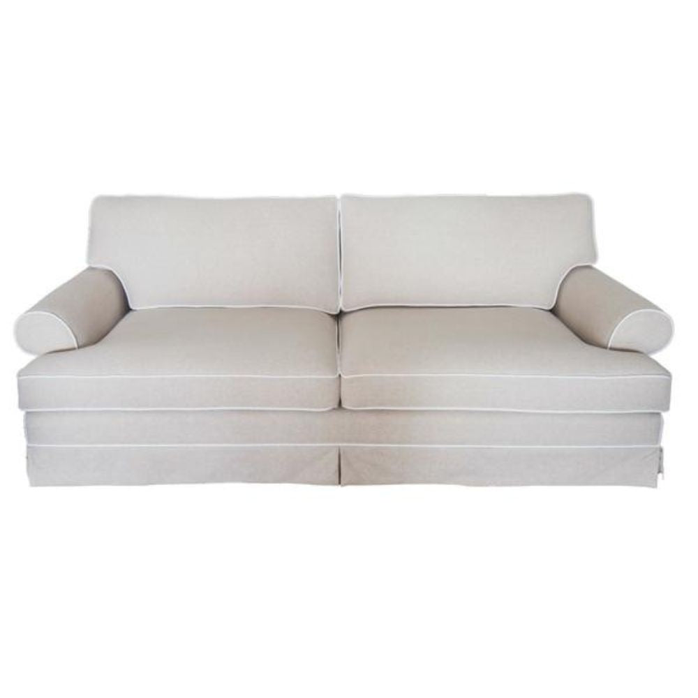 East Hampton Sofa in flax fabric with contrast white piping and skirted base
East Hampton Sofa styled in a Hamptons living room with blue and white décor