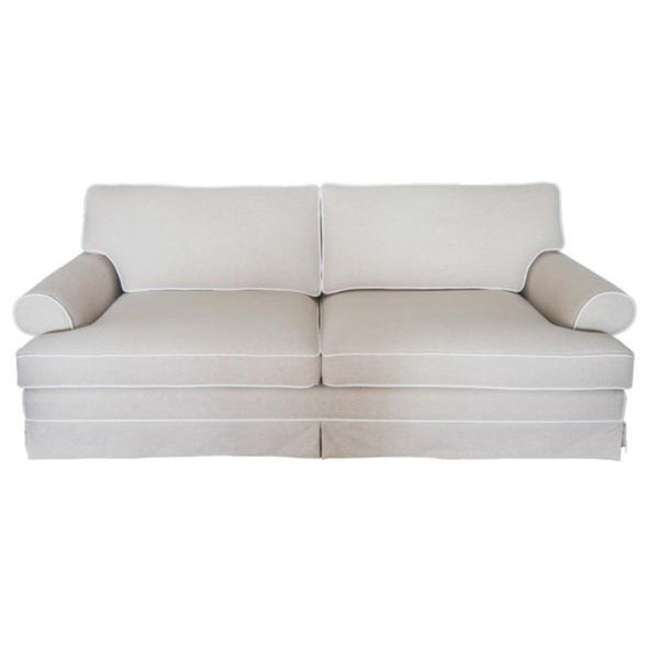 East Hampton Sofa in flax fabric with contrast white piping and skirted base
East Hampton Sofa styled in a Hamptons living room with blue and white décor