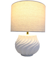 Flynn Lamp White illuminated, featuring a soft linen shade and curved ceramic base