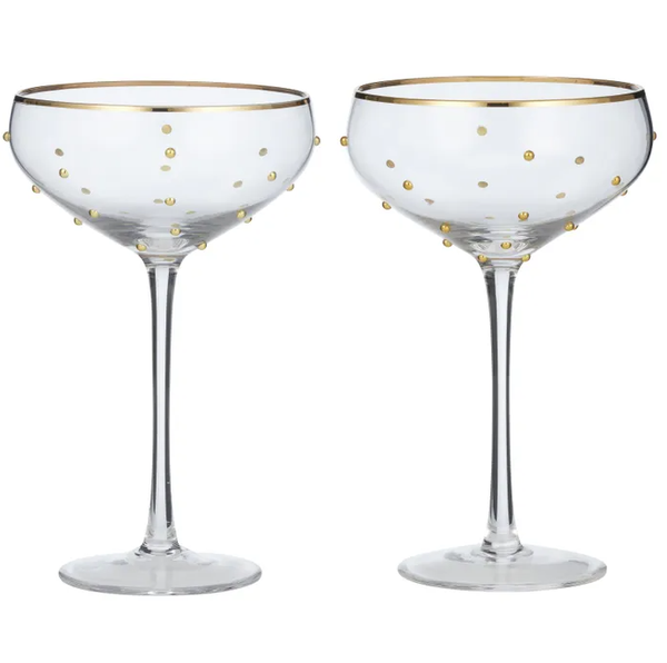 Set of two clear coupe glasses with gold polka dots and gold rim, ideal for champagne or cocktails, adding elegance to any table setting.